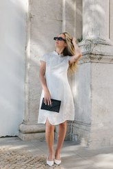 a lady in a white slit dress